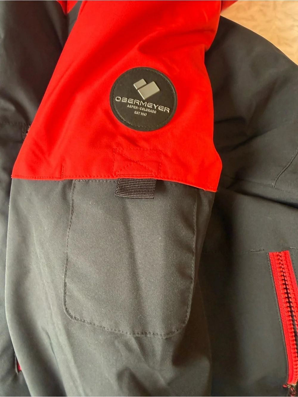 Obermeyer Boys' Axel Insulated Jacket in the colorway Brakelight (Red/Black)